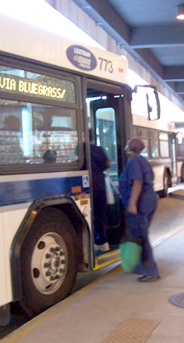 Mary boards the bus at the transit station after our talk