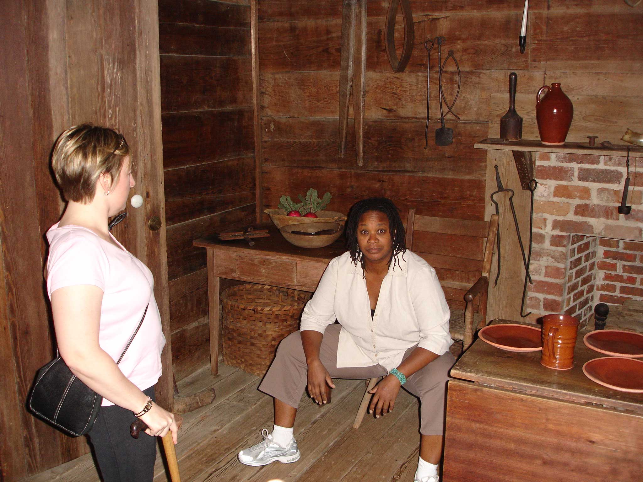 Carrie and Anita in an old cabin in Alamaba Old Town, having stepped over the rope